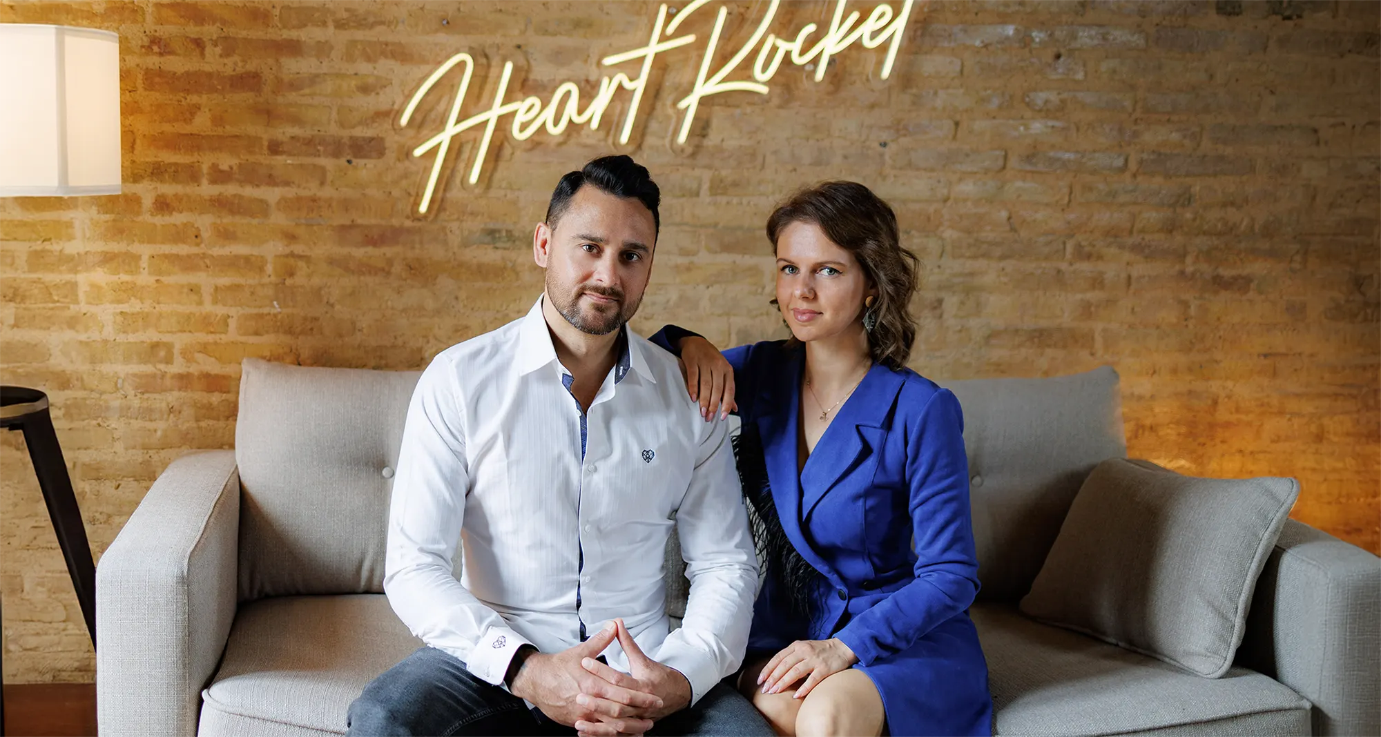 New Homepage Hero (Test) 1 Stryker and Luba in the Heart Rocket studio under their neon sign